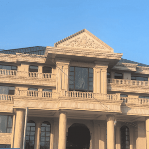 荆门黄金麻别墅外墙干挂石材效果示例